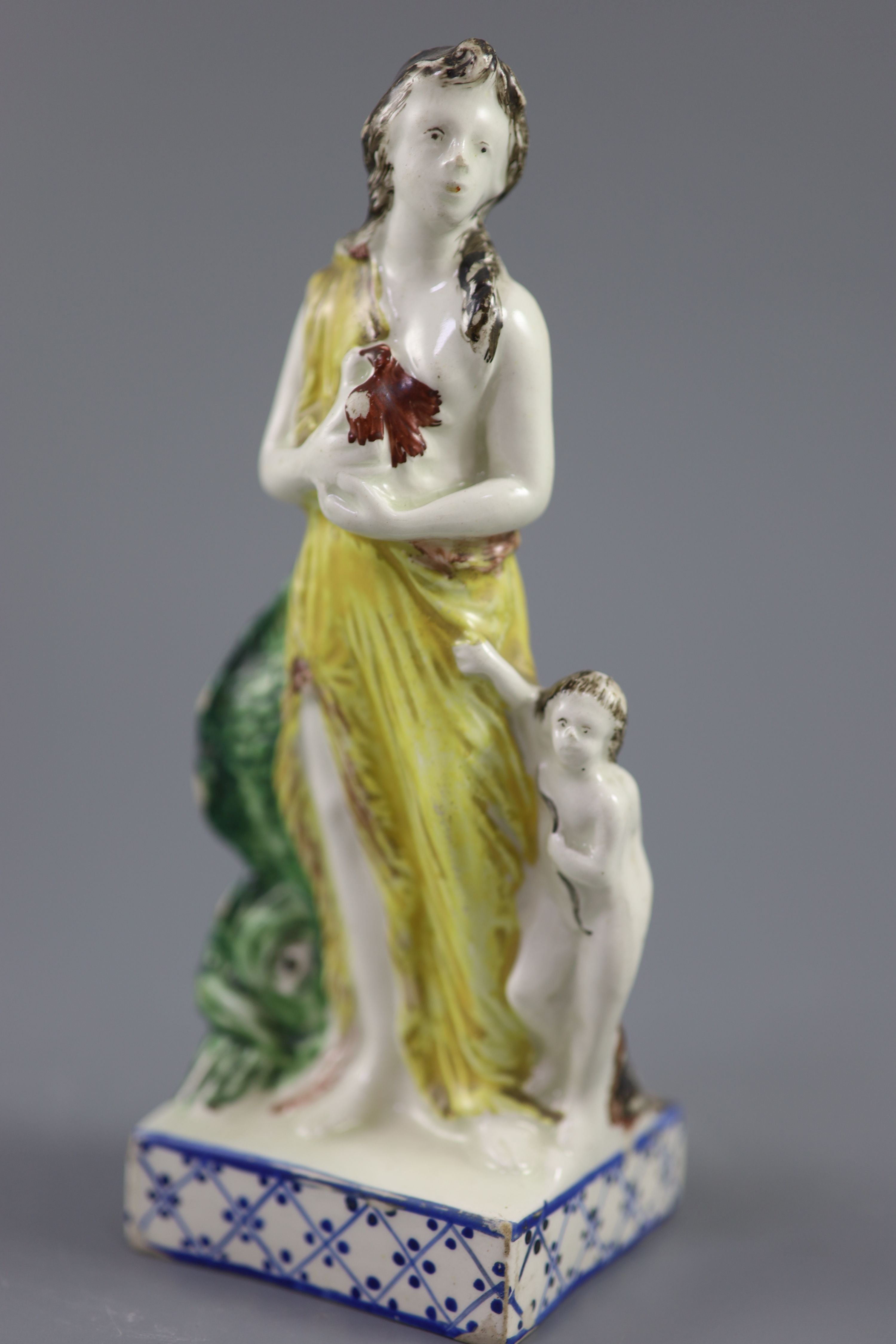 An enamelled creamware figure of Venus, attributed Leeds Pottery, c.1790-1800, 16.2cm high